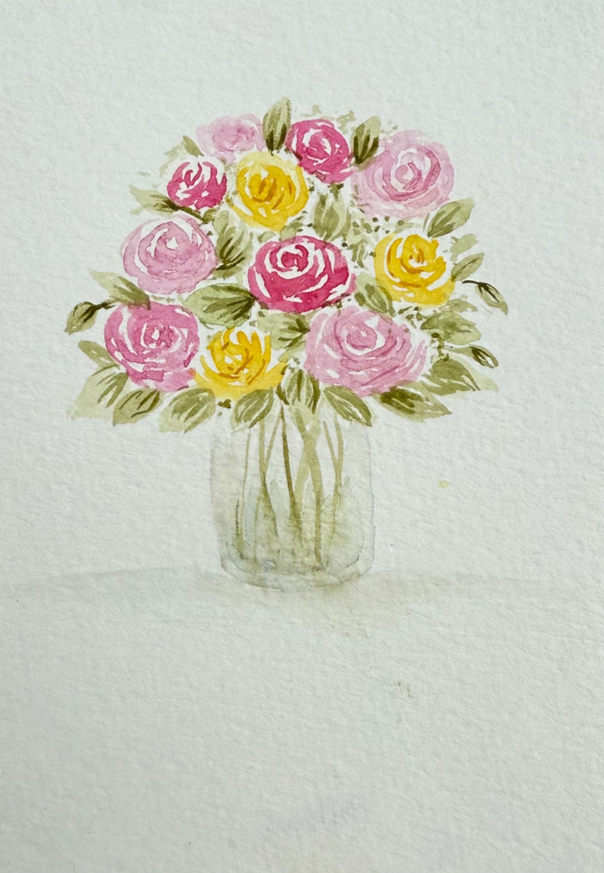 Pink and yellow roses in a glass jar