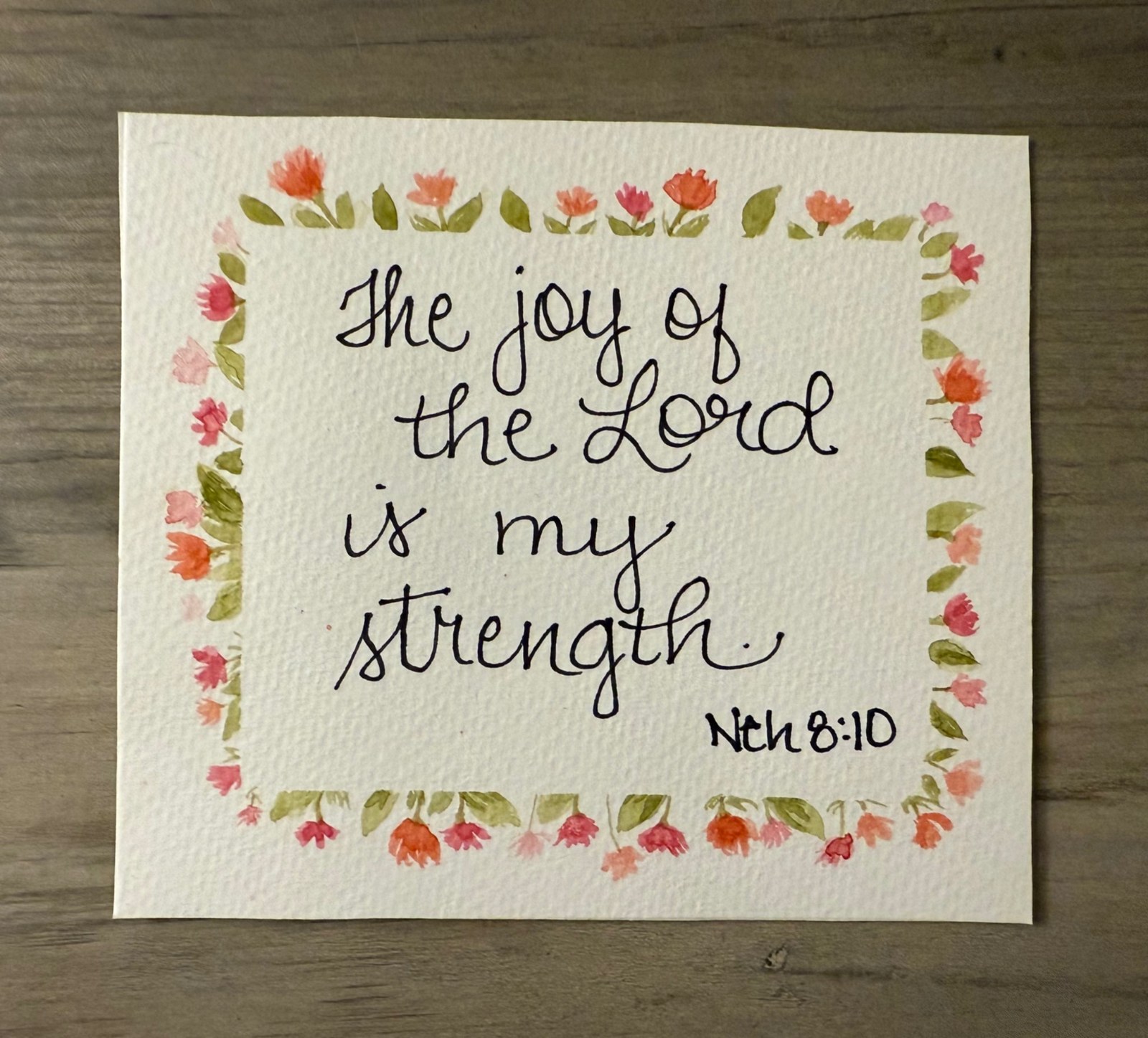 Handwritten Nehemiah 8 verse 10 surrounded by a floral border