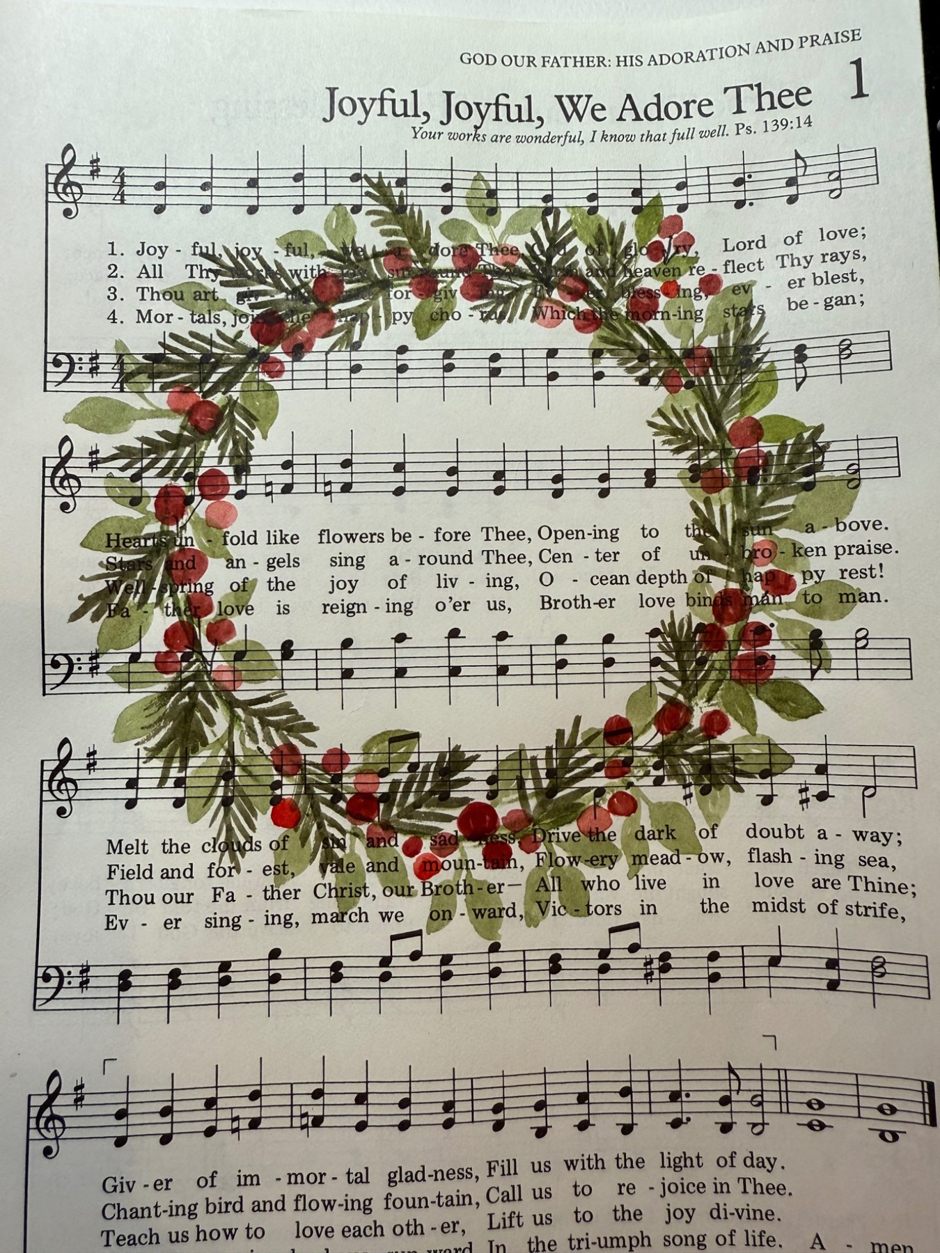 Watercolor wreath painted over a page of hymn music