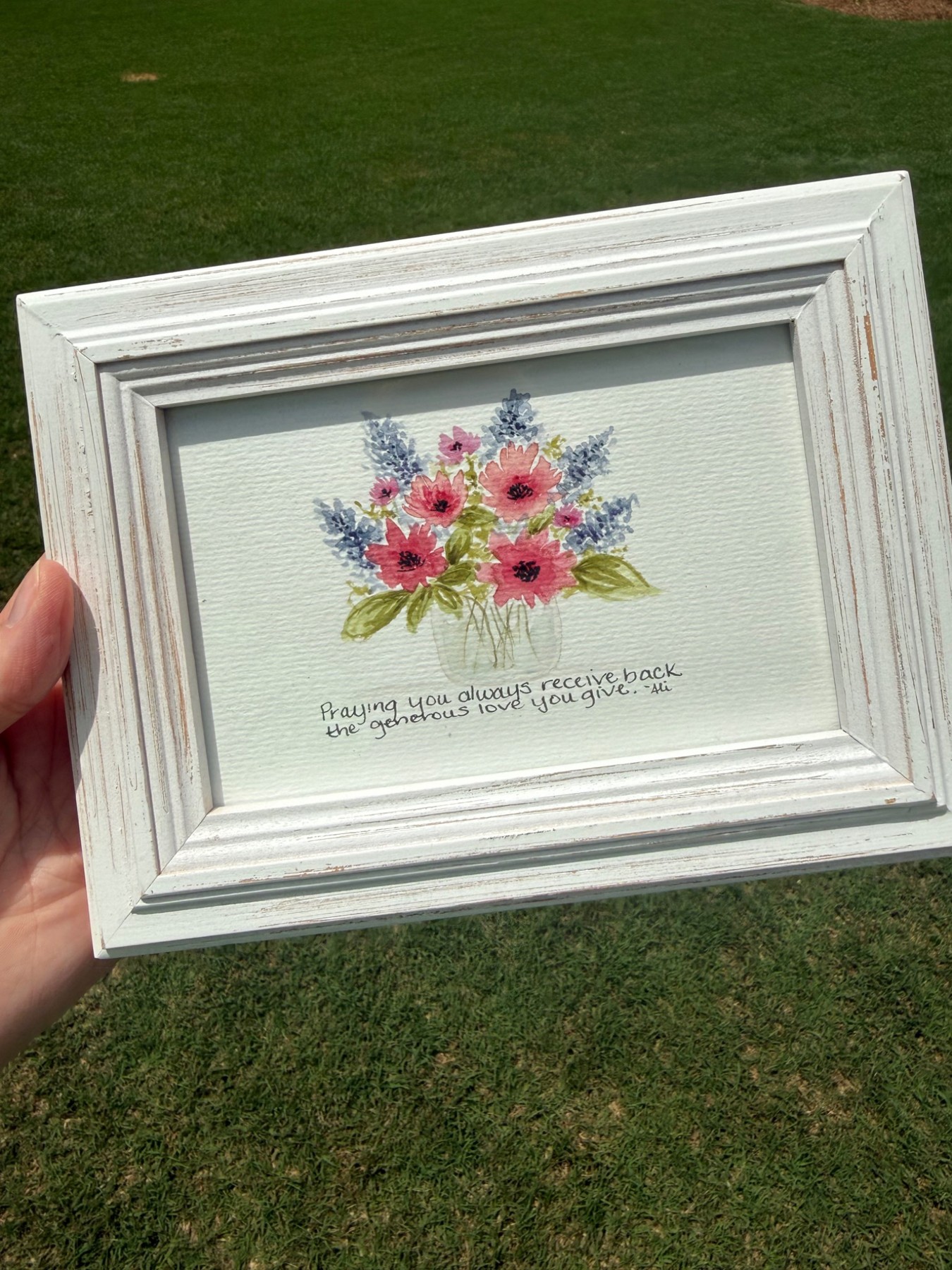 White framed watercolor bouquet with a handwritten personal message