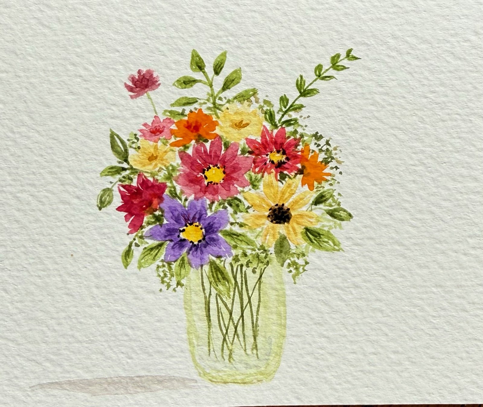 Colorful watercolor bouquet in a glass jar