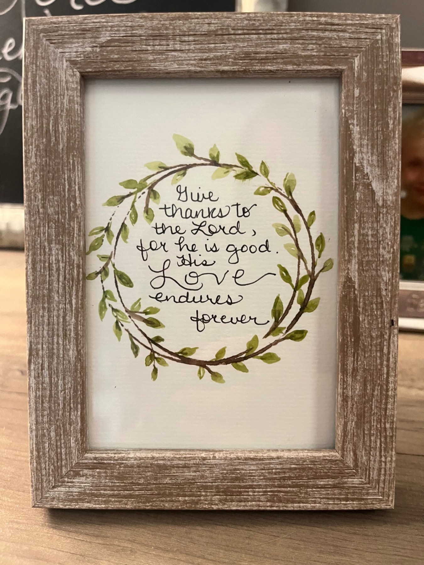 Framed botanical wreath with handwritten scripture