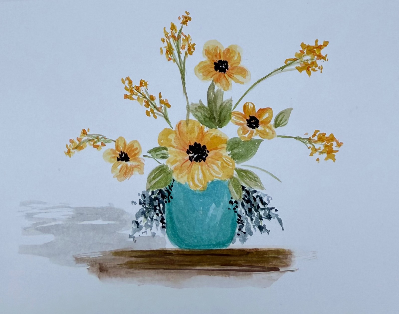 Yellow flowers in a turquoise vase