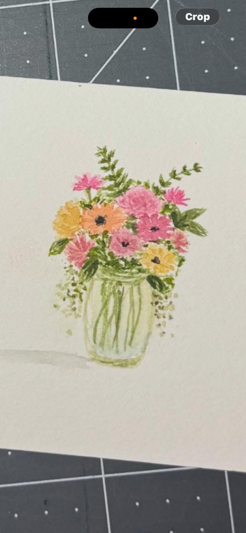 Floral watercolor on paper on a cutting mat