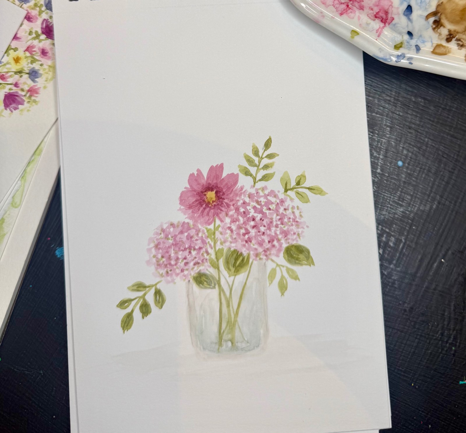 Pink hydrangeas and flowers painted in a glass jar