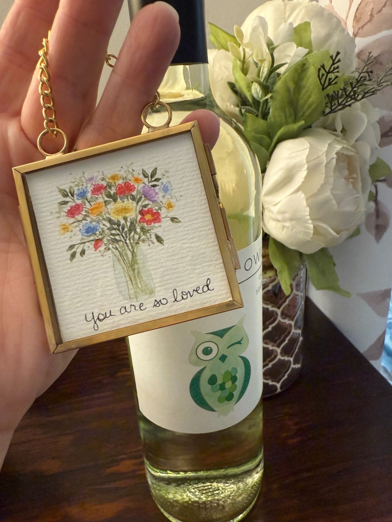 Miniature gold frame with a colorful floral bouquet
