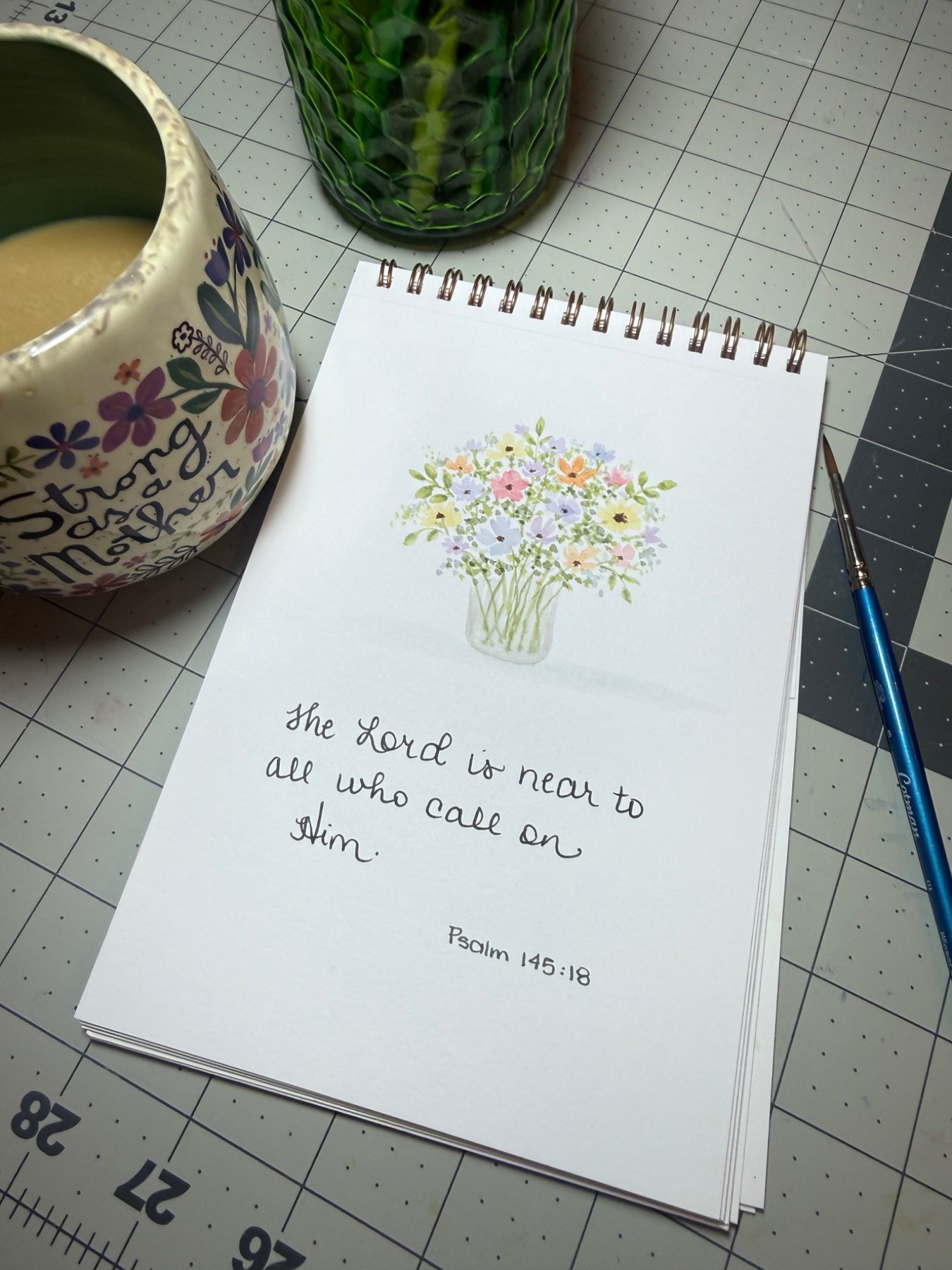 Floral watercolor and handwritten Psalm 145 verse 18 in a sketchbook